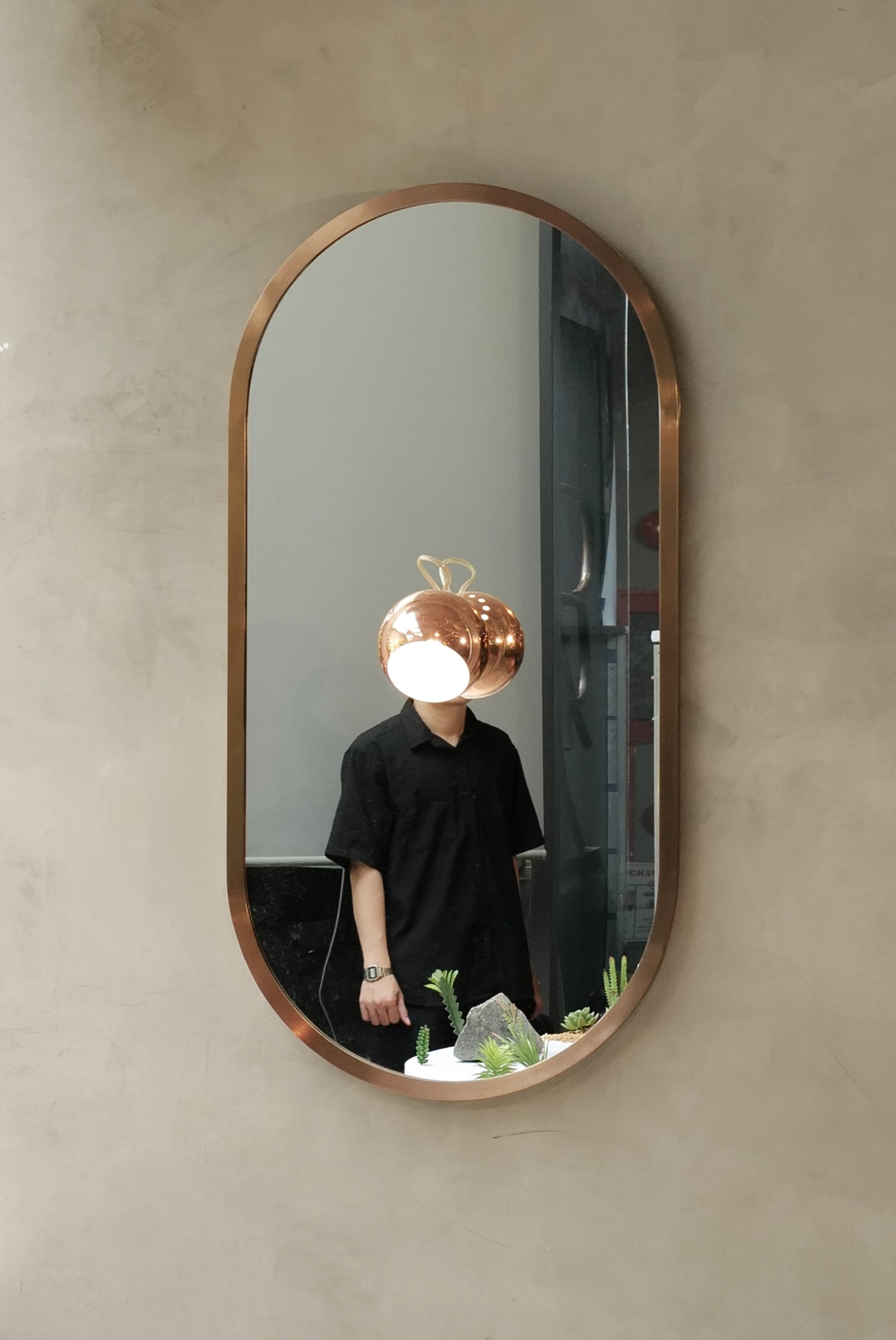 Copper lamp replaces a head in an oval mirror reflection — Le Hoang Tuan