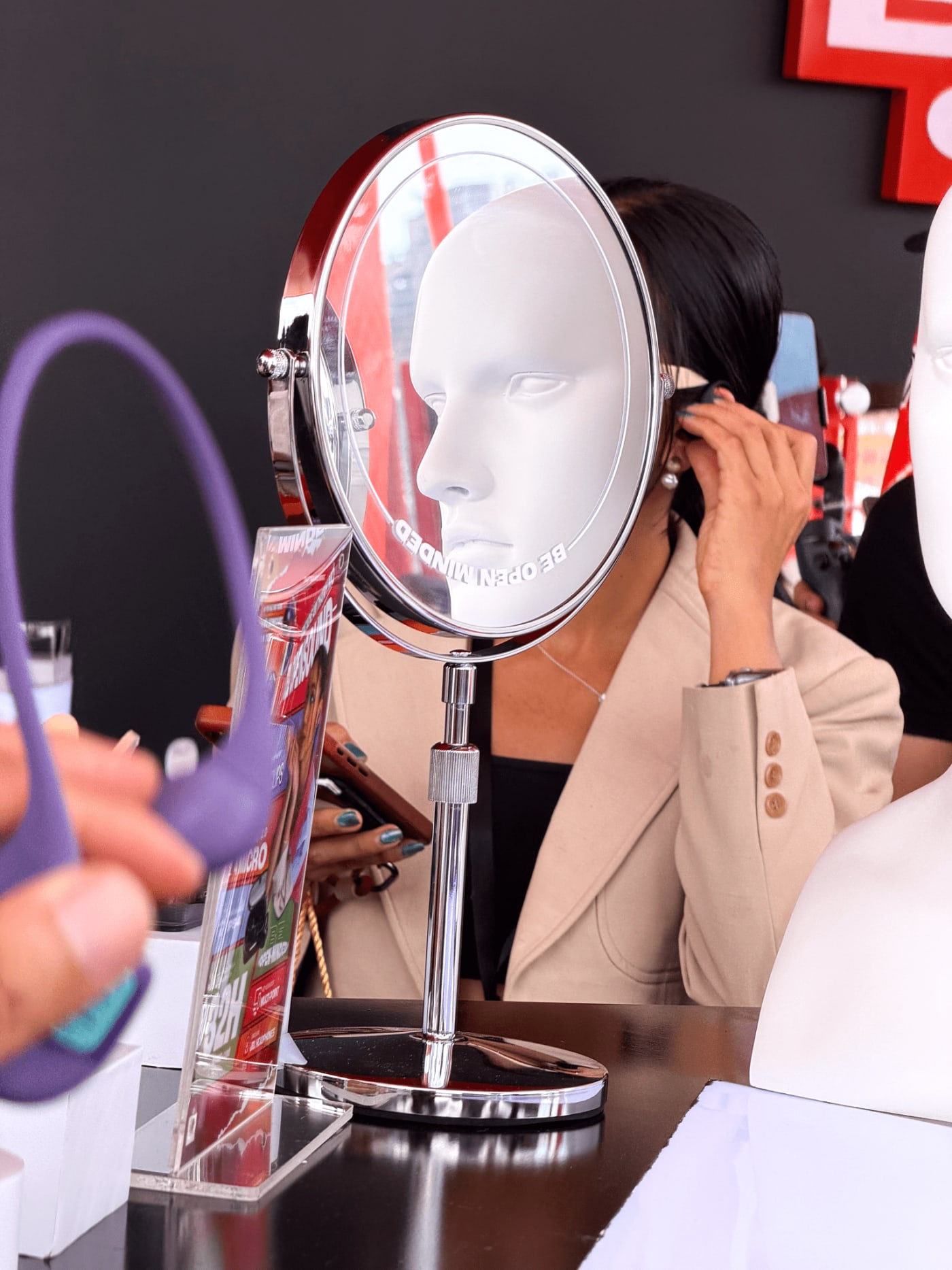 Woman’s face merges with mannequin reflection — Le Hoang Tuan