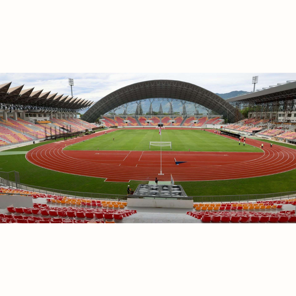 Stadion sepak bola dengan suasana pertandingan