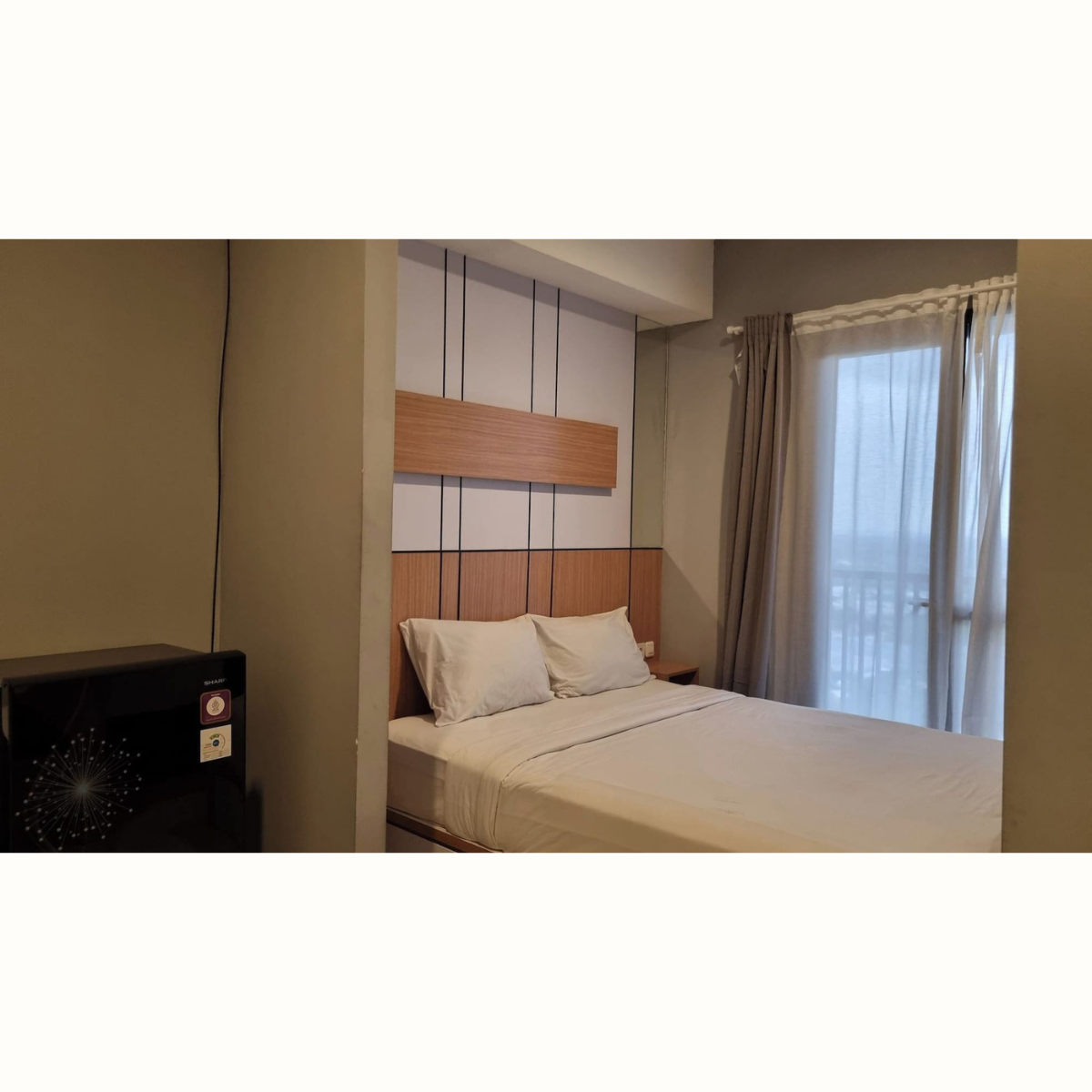 Kamar tidur nyaman di The Cozy Rooms Ayoma Residence