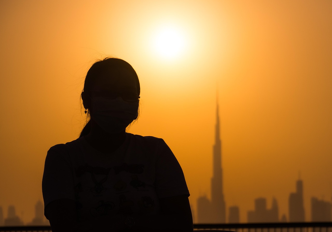 UAE: sunset, girl, silhouette, dubai, uae, landscape, skyscrapers, nature, skyline, backlighting, face mask, mask, protection, orange skies, sun, cityscape, downtown, sky, tourism, travel, architecture, buildings