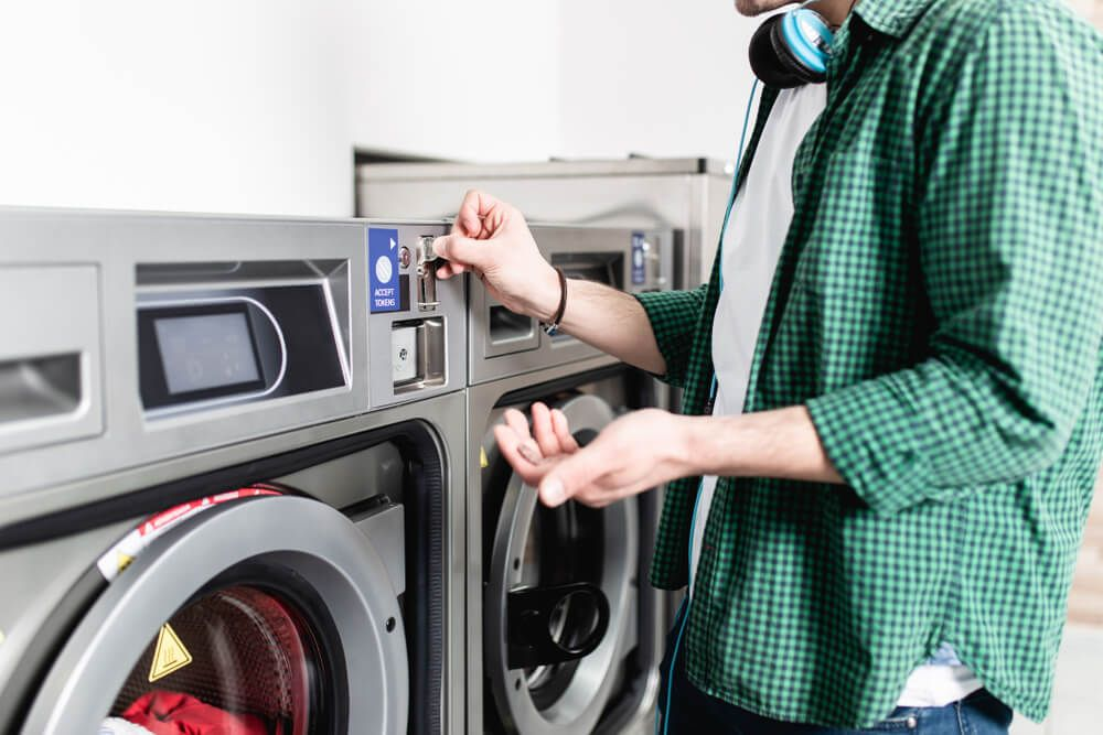 Role of a Coin Laundry Machine Distributor in Urban Laundry Services