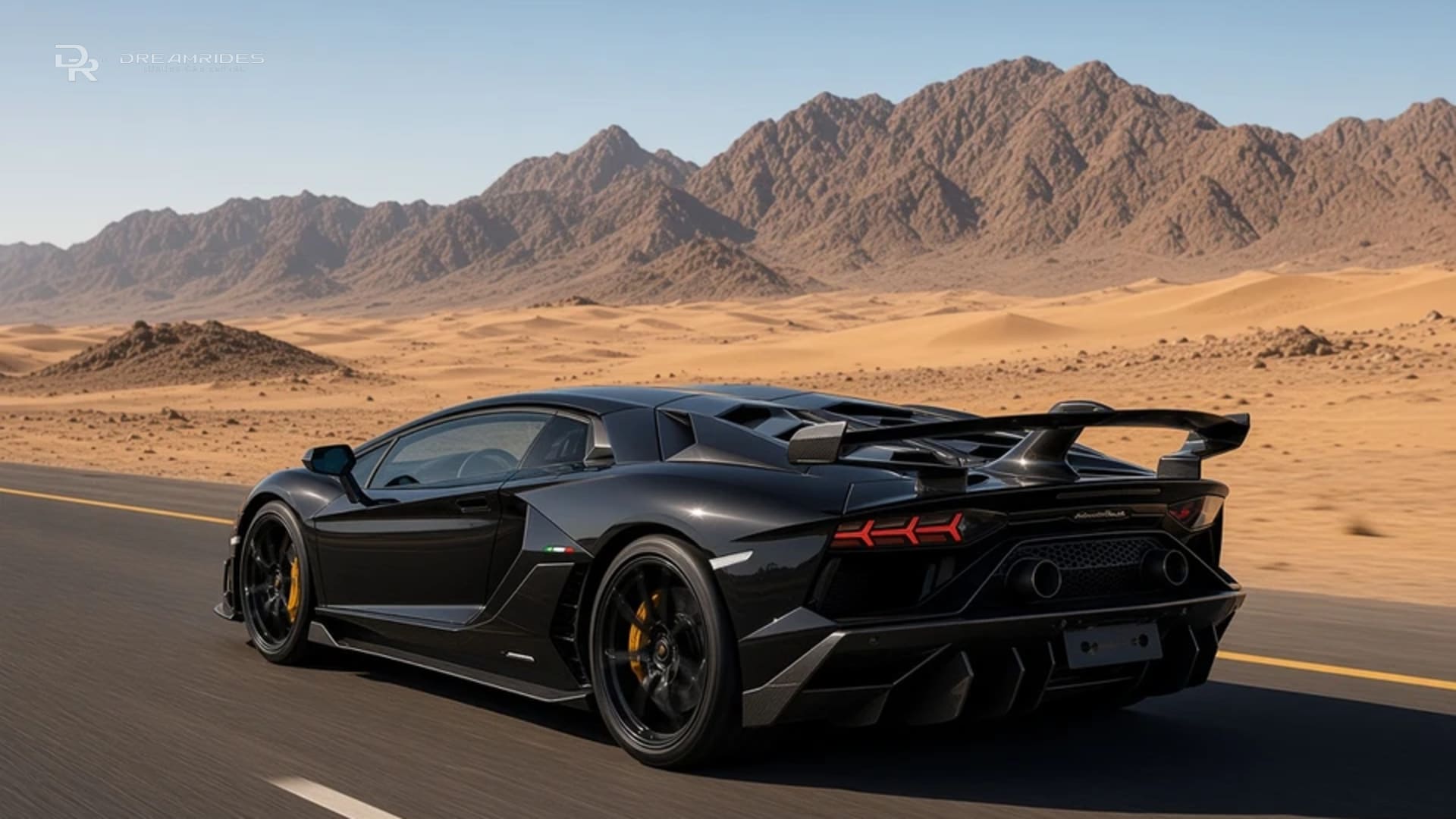Rear three-quarter view of a black Lamborghini Aventador SVJ with its fixed rear wing on an open desert highway toward the Hajar Mountains near Hatta