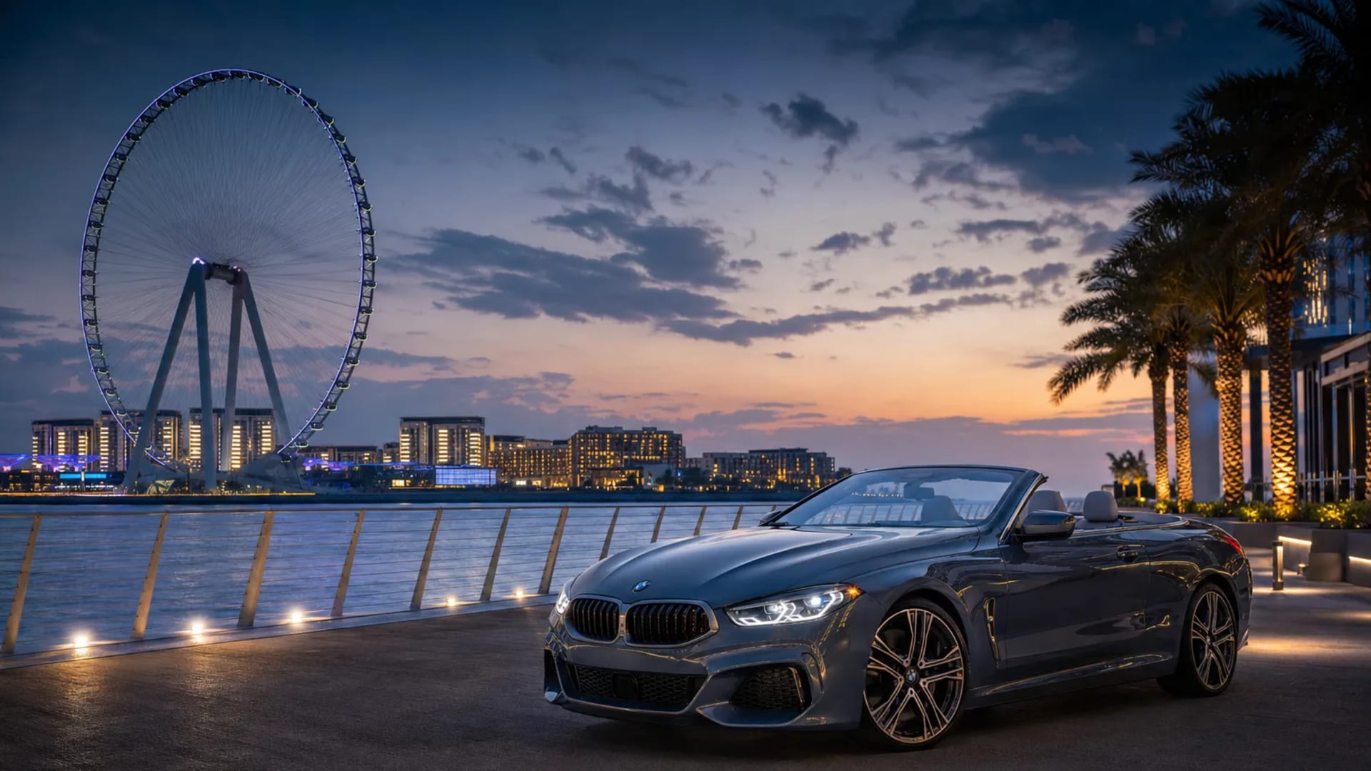 Convertible luxury car at Bluewaters Island with Ain Dubai in the background