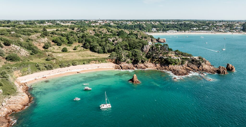 An aerial shot with Beauport in the foreground and St.Brelade's Bay in the background