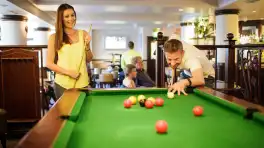 Merton Hotel - Couple playing pool