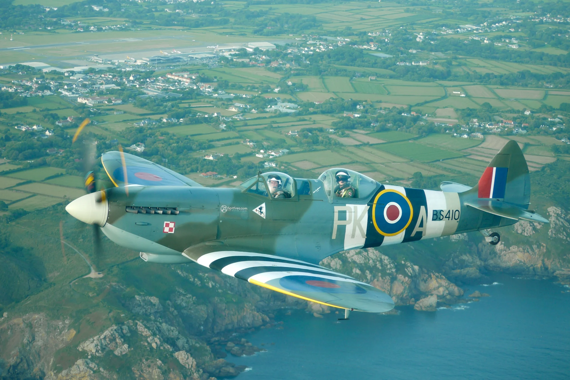 Spitfire flying over Guernsey coast