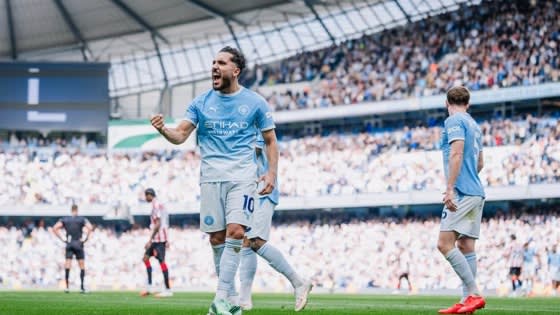 Manchester City players celebrate during their 5-3 Premier League victory over Sunderland at the Etihad Stadium