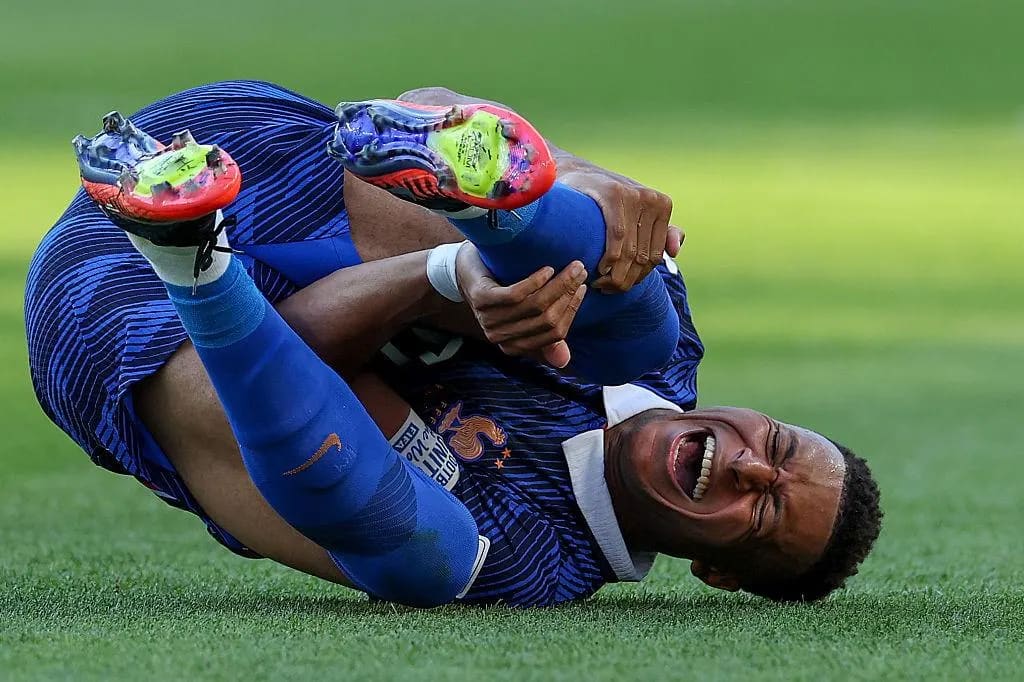 Kylian Mbappé receiving treatment while playing for France in 2026
