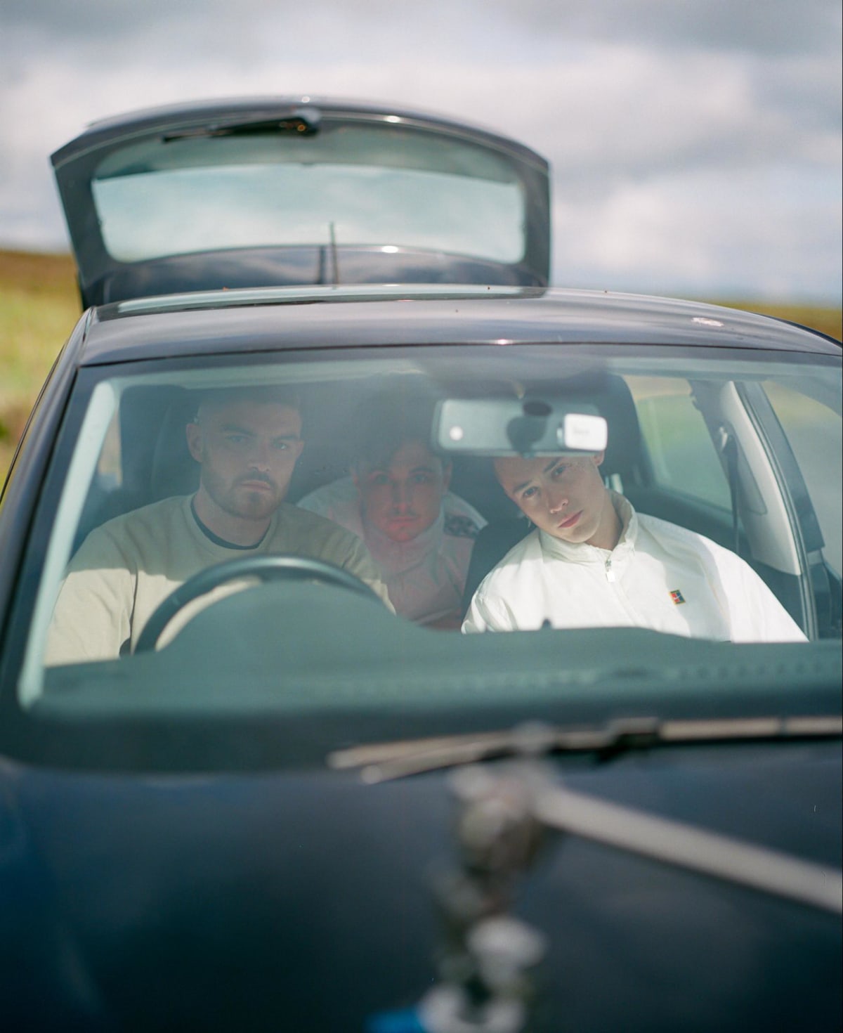 3 men in a car