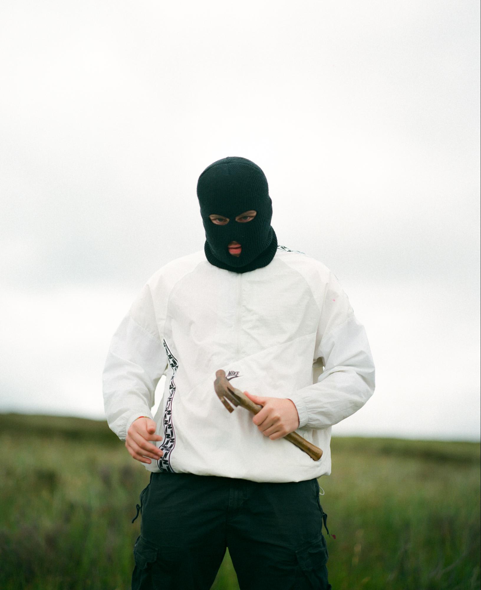 Man in mask with hammer