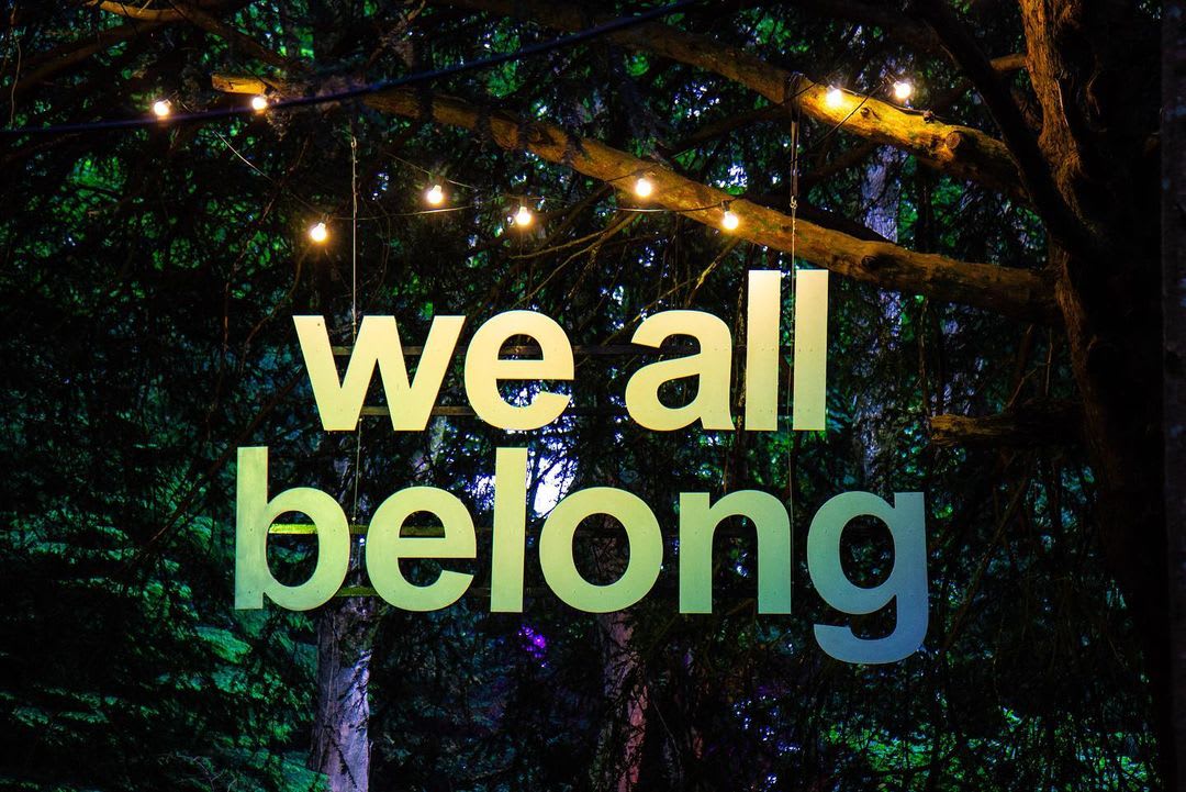 we all belong art banner