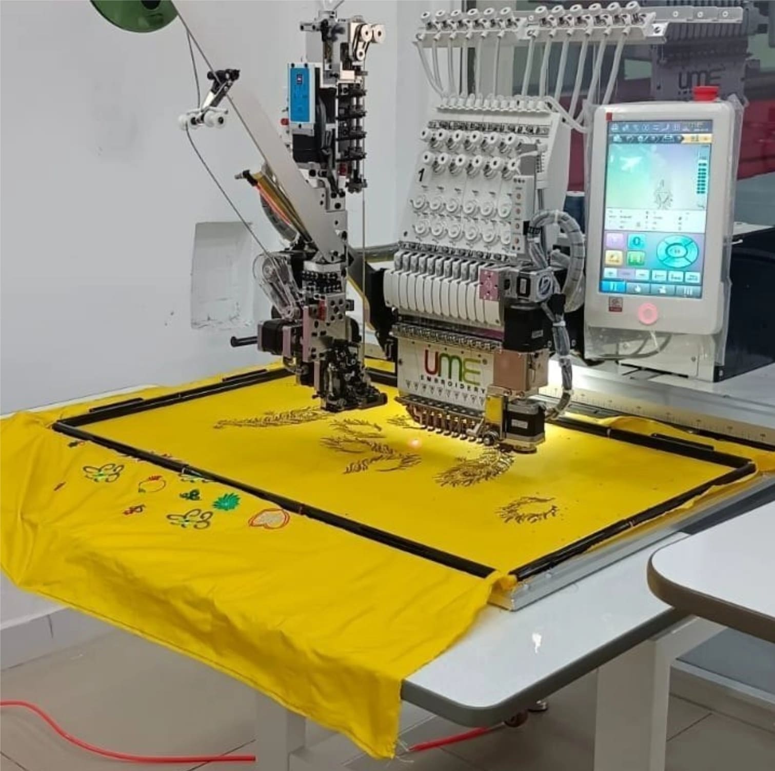 Q Printing & Embroidery industrial embroidery machine in the studio