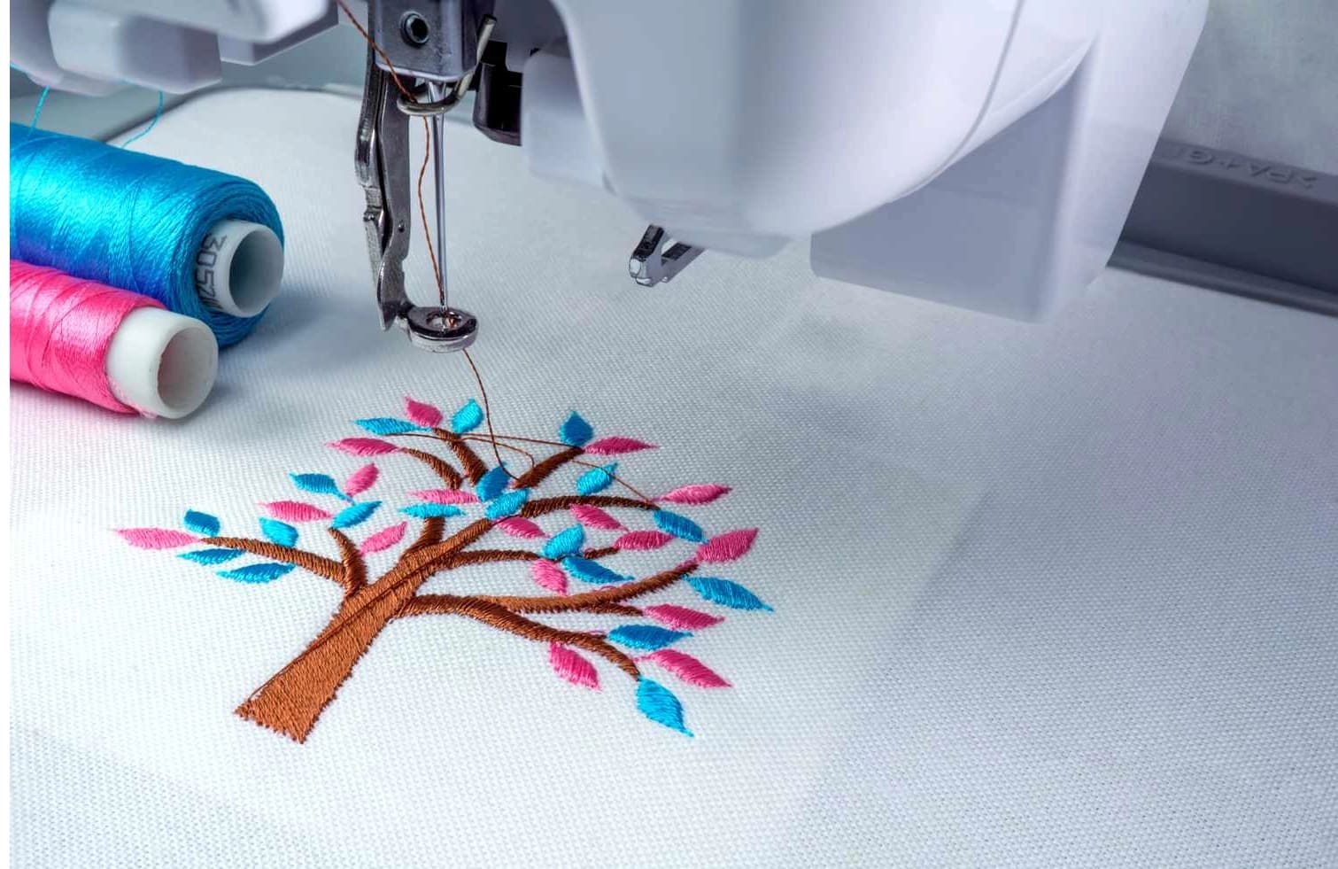 Custom multi-colour embroidery being stitched on fabric