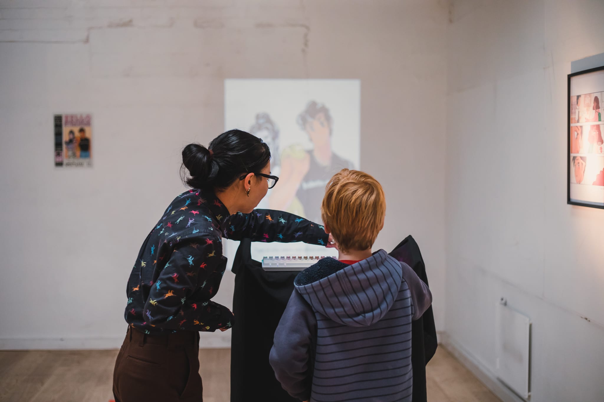 Yuko explaining “Hello Stranger” to attendee as part of Spectacle, a locally funded Ōtepoti event.