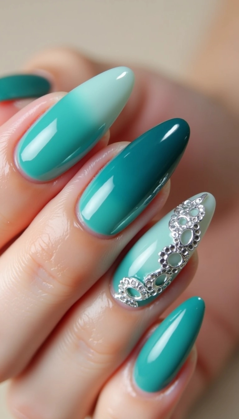 Design a set of long, stiletto-shaped nails featuring a gradient effect that transitions from a deep teal to a lighter aqua. Instead of gemstones, embellish one nail with a delicate silver lace design. The overall color scheme should evoke a serene oceanic feel, and the background can be a soft beige to highlight the nail art.