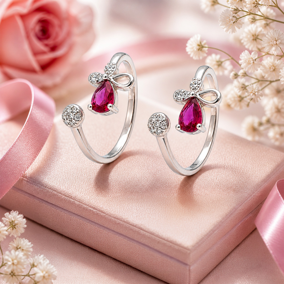 Ribbon Rose — bow and pink stone silver ring