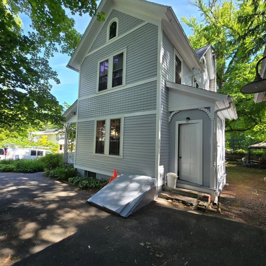 Exterior Restoration: Siding & Porch Refinishing - after