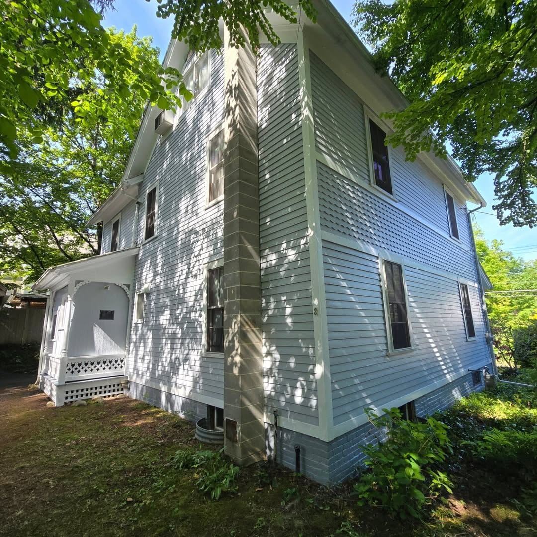 Exterior Restoration: Siding & Porch Refinishing - after