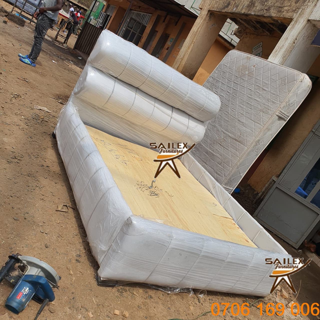 White Bolster-Style Bed