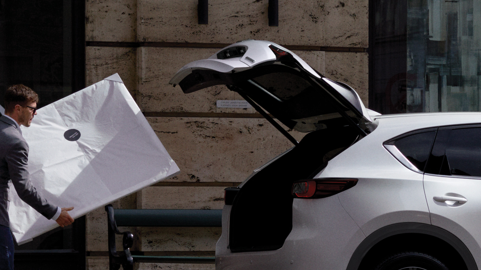 Mazda CX-5 lifestyle side profile with open tailgate