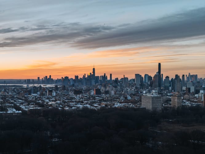 An image of a cityscape and urban in a sunrise.