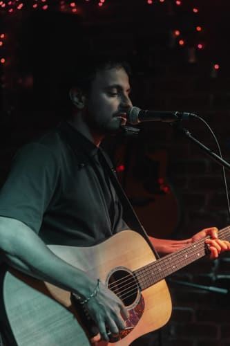 An image of a urban and conceptual engaged in performance with a introspective atmosphere.