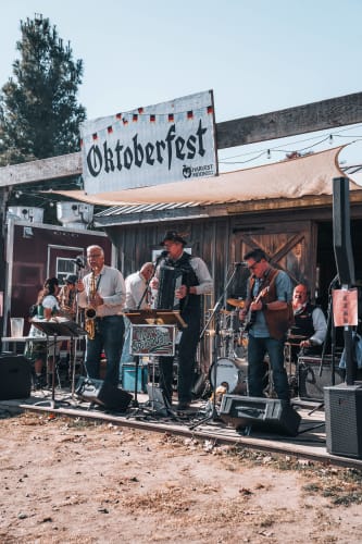 An image of a culture engaged in performance in an outdoor setting.