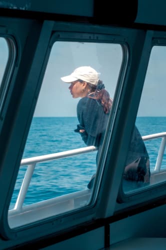 An image of a travel and self-portrait engaged in working with a introspective atmosphere.