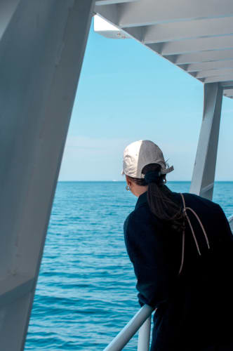 An image of a travel and self-portrait engaged in working with a introspective and calm feel.