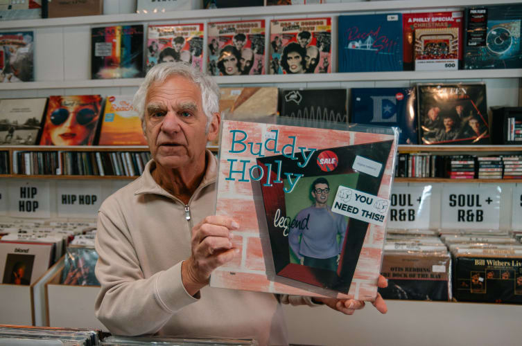 An image of a culture and urban engaged in music in a workspace.