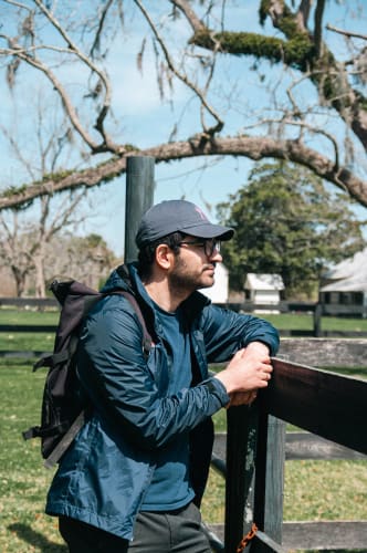 An image of a travel and urban engaged in walking in a park.