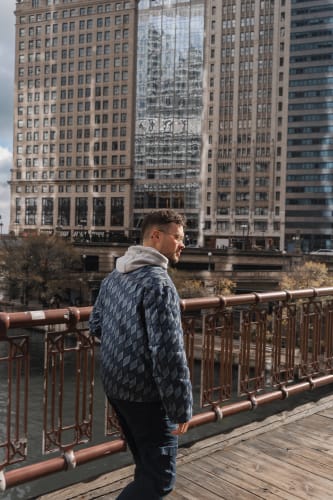 An image of a urban and cityscape engaged in walking with a introspective atmosphere.