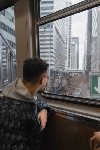 An image of a travel and urban engaged in reading with a introspective atmosphere.