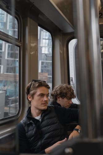 An image of a travel engaged in reading with a introspective atmosphere.