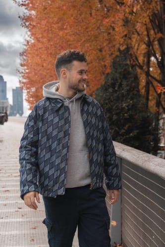 An image of a urban engaged in walking in an outdoor setting.