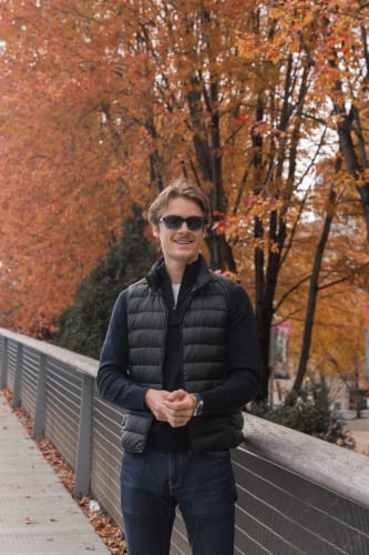 An image of a travel engaged in walking in an outdoor setting.