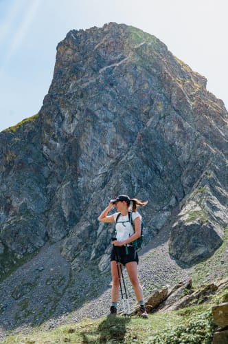 An image of a travel engaged in walking in a mountain.
