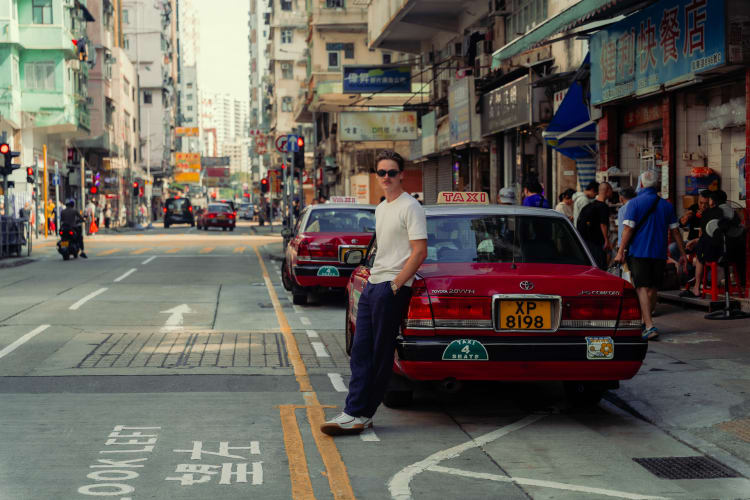 An image of a street and travel engaged in walking in a city.