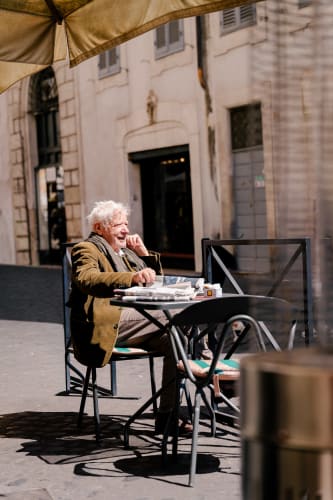 An image of a lifestyle engaged in reading in a cafe.