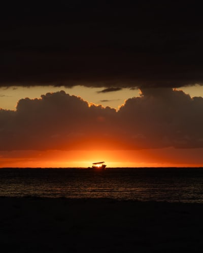 An image of a travel in a sunset.