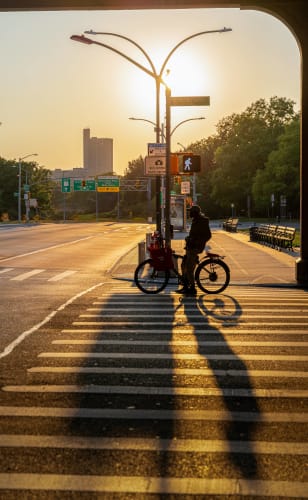 An image of a street and cityscape engaged in walking in a evening.