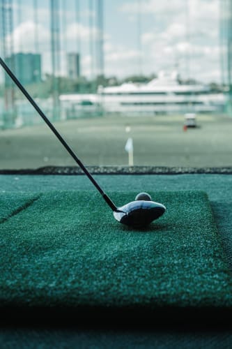 An image of a urban and macro engaged in sport in an indoor setting.