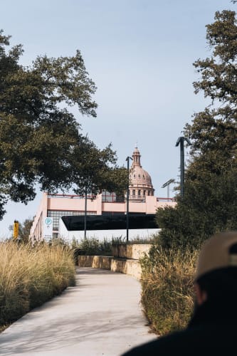 An image of a travel and gardens engaged in walking in a landmark.