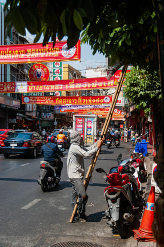 An image of a street and travel engaged in working in a cultural site.
