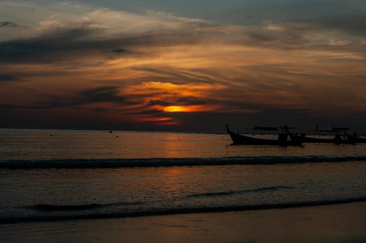 An image of a travel in a sunset.