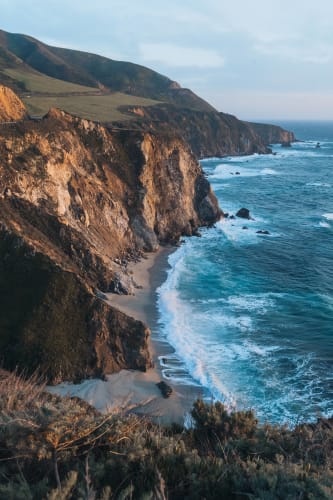 An image of a landscape, travel, and nature in a beach with a energetic atmosphere.