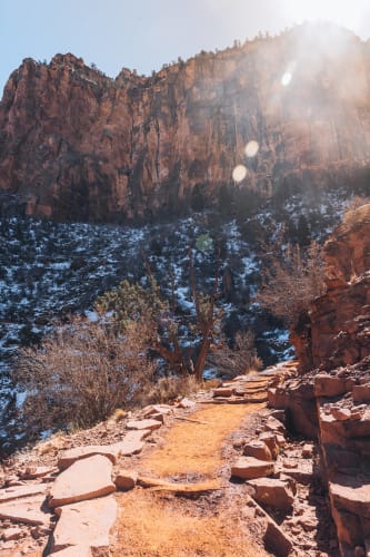 An image of a landscape and travel engaged in walking in a mountain.