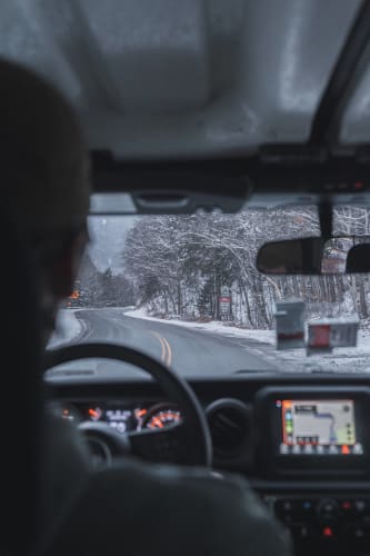 An image of a travel and interior engaged in running in a winter with a moody atmosphere.