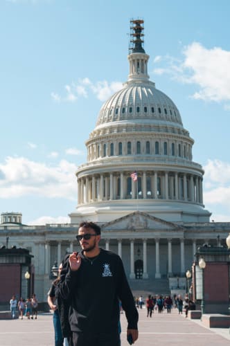 An image of a culture and portrait engaged in performance in a landmark.